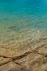 Canada, British Columbia, East Kootenay Mountains. Rocks under clear lakeshore water. Art Print